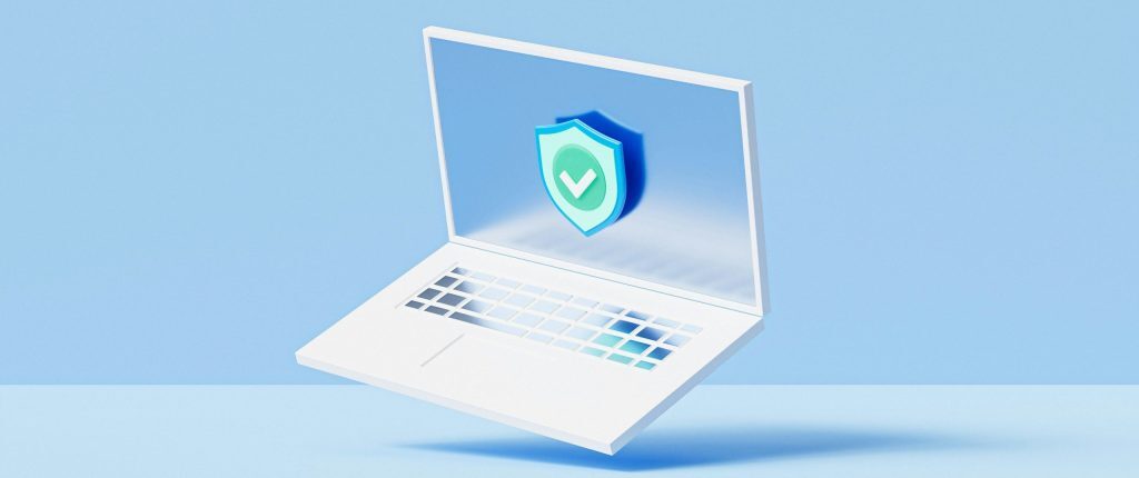 3D illustration of an open laptop displaying a blue shield with a checkmark on its screen – minimalist design with light blue background; represents cybersecurity, data protection, or verified system security.