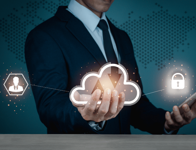 A businessman holds a glowing cloud icon with upload and download arrows, connected to holographic symbols of a user and a padlock, representing cloud computing, data transfer, and secure digital management.