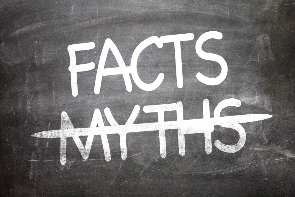 Chalkboard with the word MYTHS crossed out and the word FACTS written clearly above it in bold white letters, symbolizing the concept of debunking misinformation or distinguishing truth from falsehood.